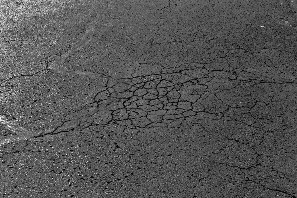 alligator cracking pothole formation asphalt parking lot
